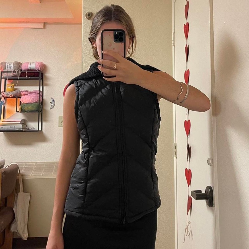 the black puffy vest with knit collar